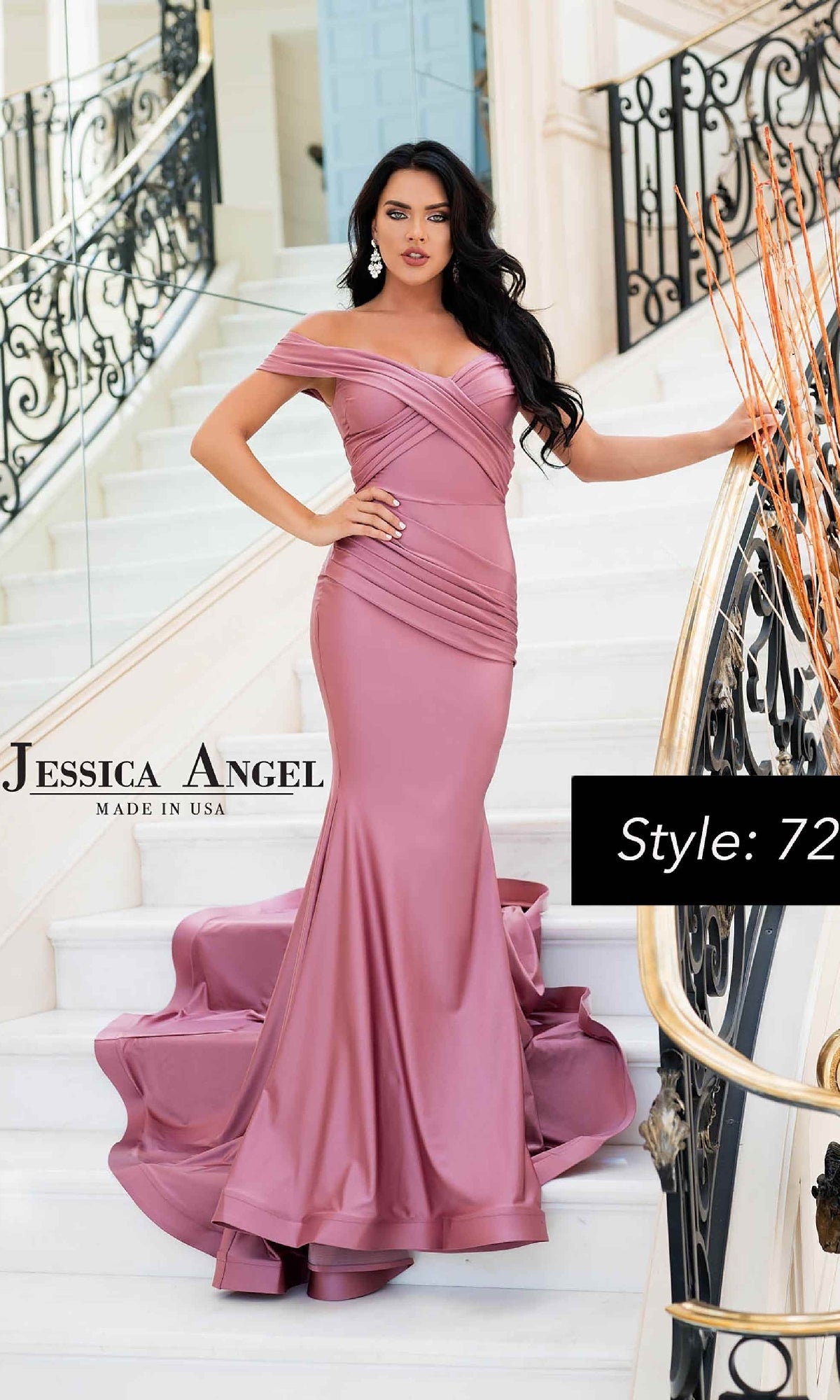 A woman poses on a staircase in the Criss-Cross Long Prom Dress: Jessica Angel 721, a fitted mauve gown with an off-the-shoulder neckline, dramatic mermaid silhouette, and long train—ideal for elegant occasions.